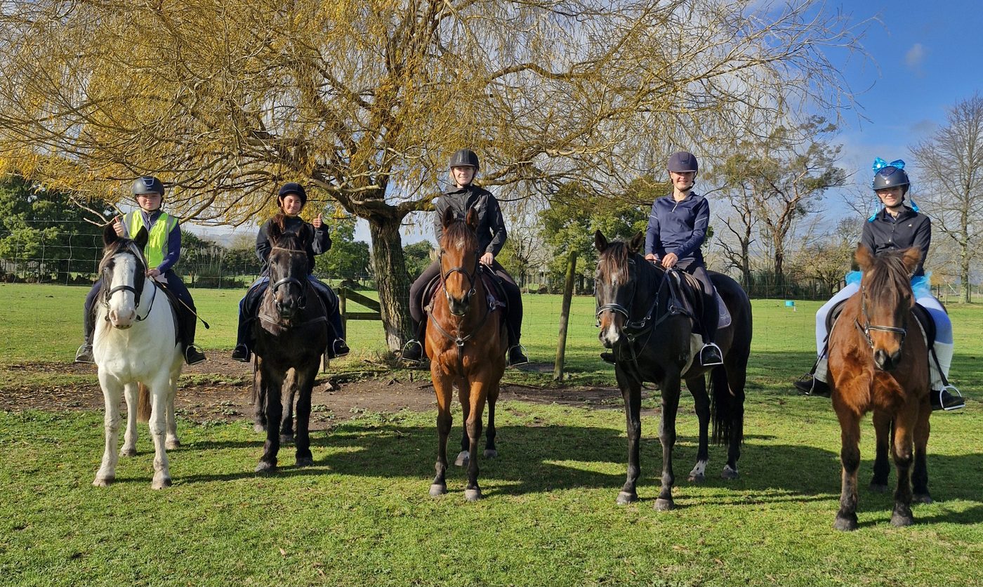 Riders lined up under the willow tree at Acreswild